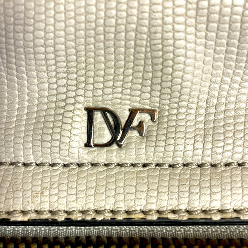 DVF Purse leather and nicely put together.